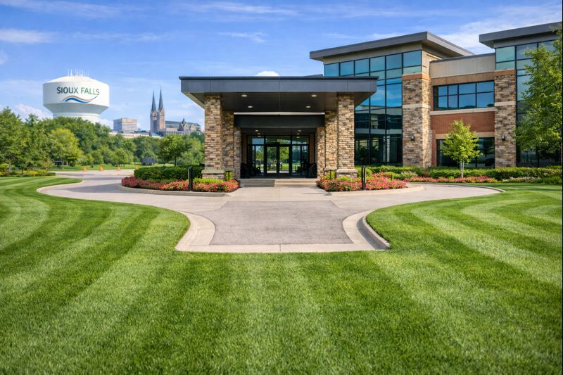 Commercial property entrance turf maintained to a clean standard